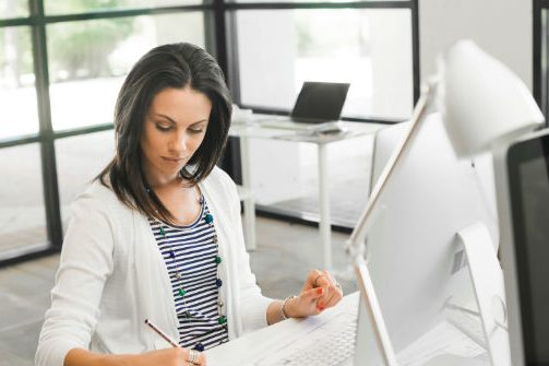 pretty-woman-using-computer-PA46RK6